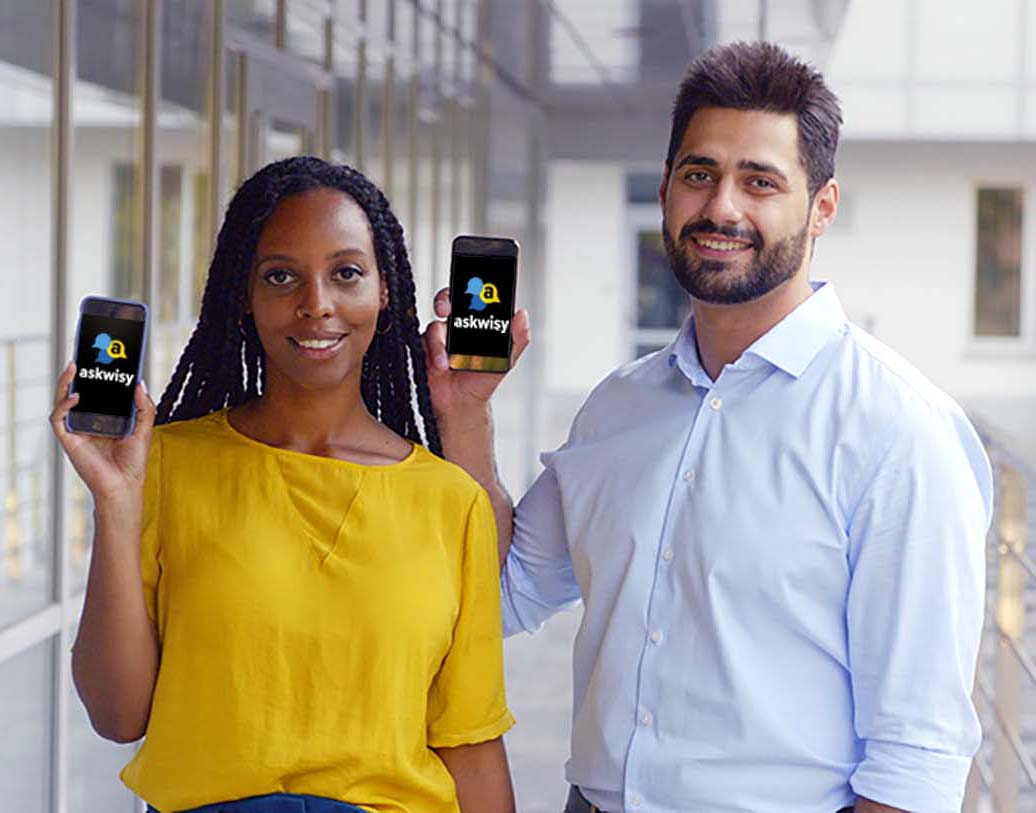 Professional woman and man showing phones with AskWisy app